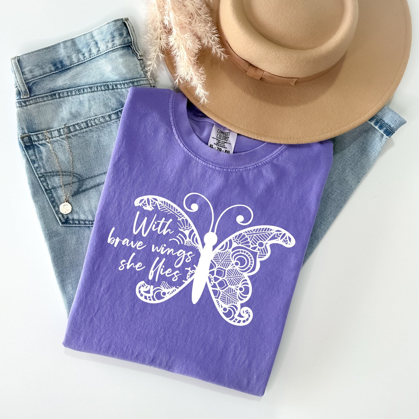 With Brave Wings She Flies - Comfort Colors Graphic Tee